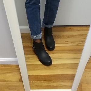 Black moto rain boots.